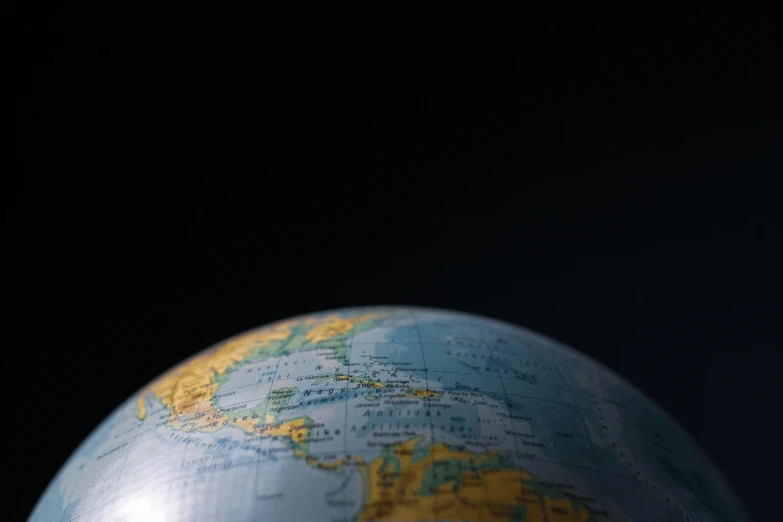 a close up of a globe on a table, with a black background, thumbnail, puerto rico, mapbox