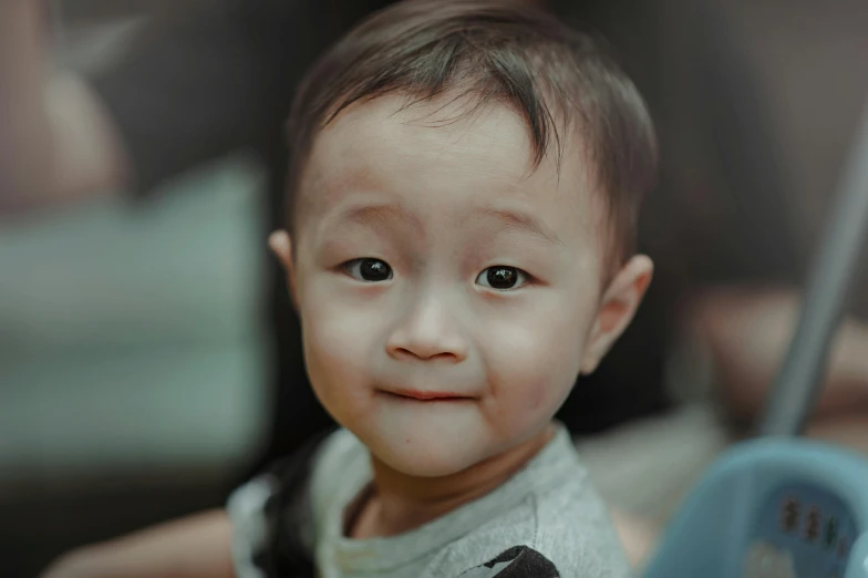 a close up of a child holding an umbrella, darren quach, is looking at the camera, rounded eyes, wide neck