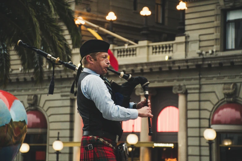 a man in a kilt playing a bagpipe, pexels contest winner, central station in sydney, photograph of san francisco, 🚿🗝📝, thumbnail