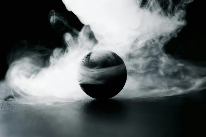 a black and white photo of a ball of smoke, an album cover, inspired by Otto Piene, unsplash contest winner, made of liquid metal and marble, mysterious atmosphere, levitating agricultural sphere, photograph taken in 2 0 2 0