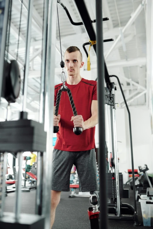 a man holding a rope in a gym, by Adam Marczyński, square, lightweight, advertising photo, multi-part