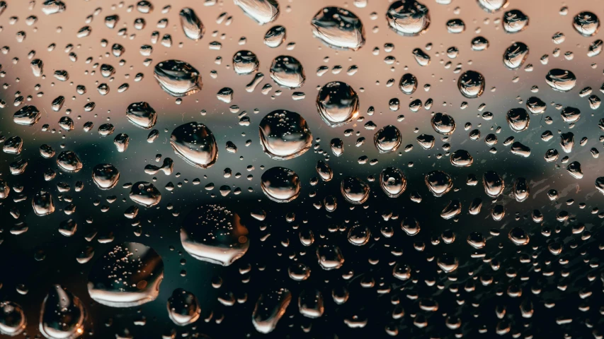 a close up of water droplets on a window, by Carey Morris, trending on unsplash, hyperrealism, paul barson, liquid metal, wet reflections in square eyes, it\'s raining