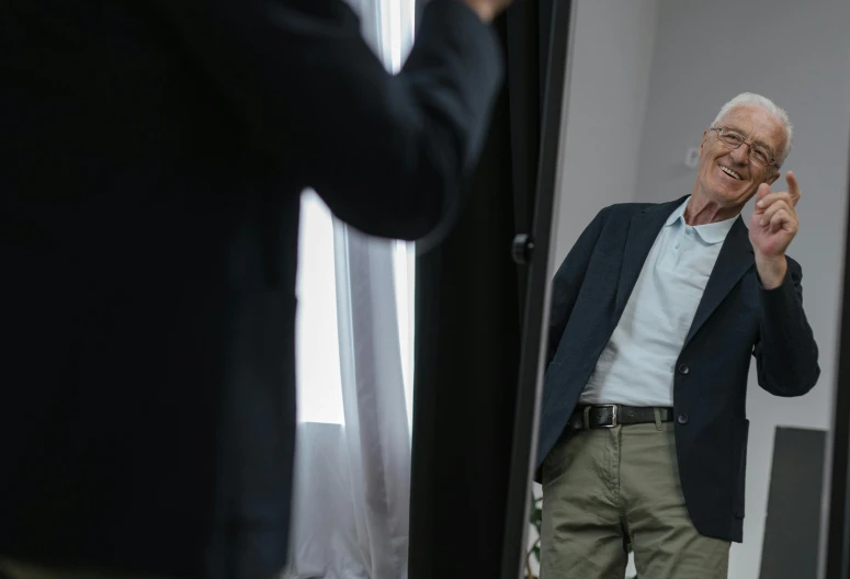 a man standing in front of a mirror talking on a cell phone, full-frame of bernie sanders, anthony hopkins, professional photoshoot, business clothes