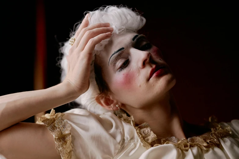 a close up of a person with makeup on, inspired by Pietro Longhi, rococo, desperate pose, white head, filmstill, dancer