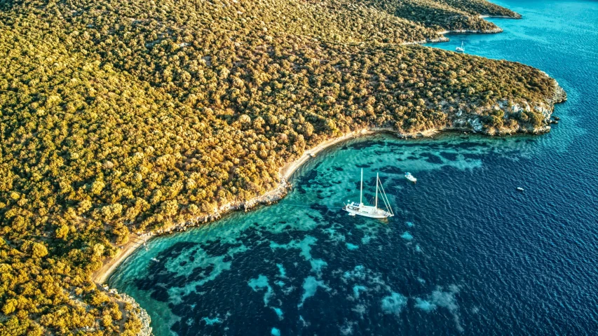 a couple of boats floating on top of a body of water, by Micha Klein, pexels contest winner, hurufiyya, croatian coastline, amongst foliage, sailboat, birdeye