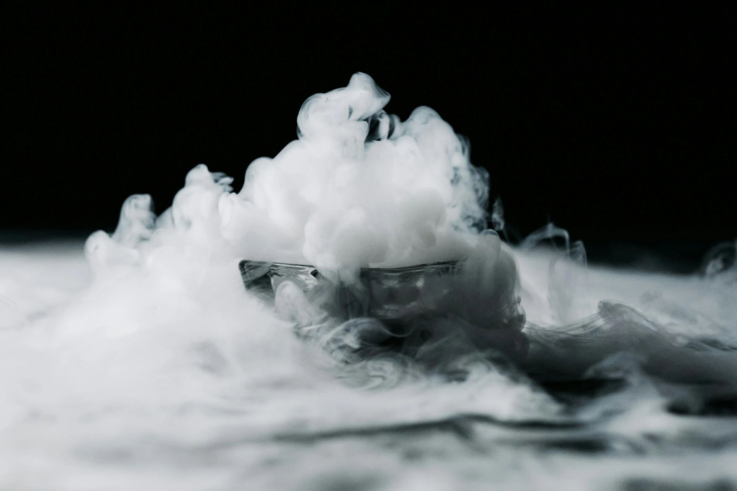 a black and white photo of a cloud of smoke, unsplash, surrealism, milk bath photography, miniature product photo, liquid cooled, thc