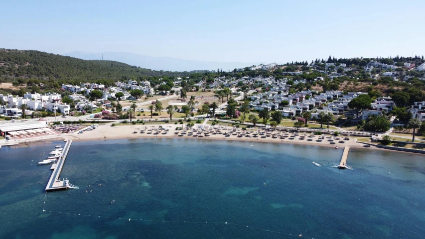 a large body of water next to a beach, by Julian Allen, pexels contest winner, hurufiyya, turkey, wide high angle view, arma 3 screenshot, holiday resort