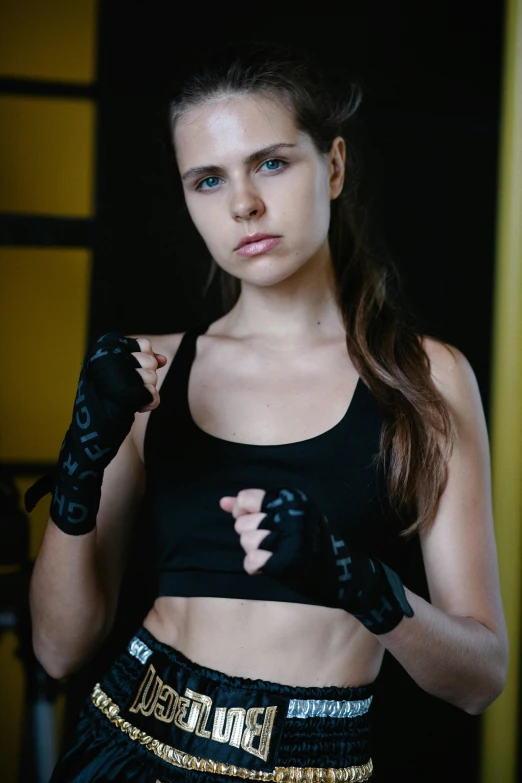 a woman posing for a picture in a boxing ring, a portrait, pexels contest winner, training bra, promo image, yulia nevskaya, black