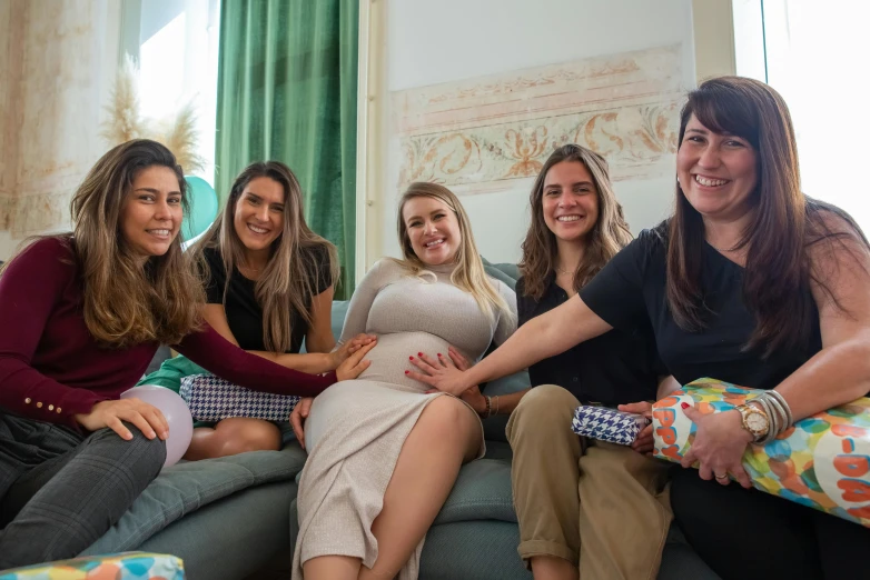 a group of women sitting on top of a couch, by Emanuel Witz, pexels contest winner, pregnancy, avatar image, spanish, 278122496