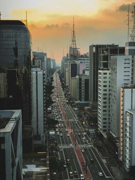 a city street filled with lots of tall buildings, an album cover, pexels contest winner, hyperrealism, sao paulo in the year 2 0 7 0, 2 0 0 0's photo, predawn, high resolution photo