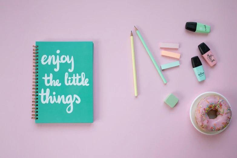 a notebook with the words enjoy the little things written on it, a picture, by Arabella Rankin, trending on unsplash, graffiti, pink white turquoise, knolling, mint, paint on canvas