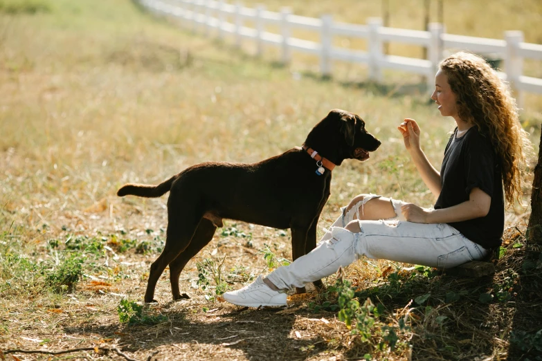 a woman sitting on the ground next to a dog, pexels contest winner, 15081959 21121991 01012000 4k, ready to eat, aussie, thumbnail