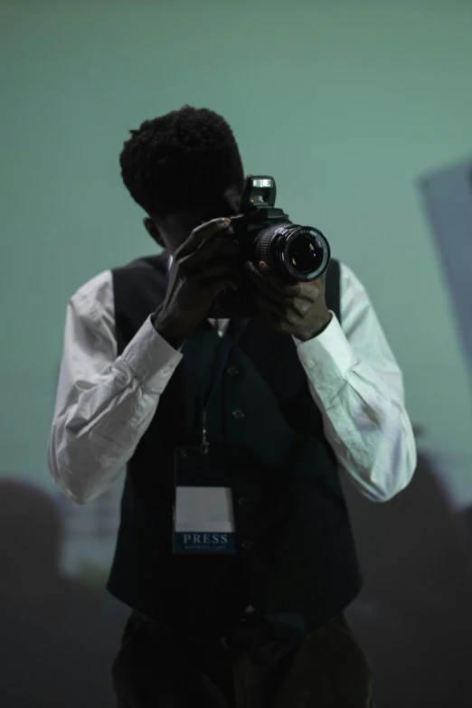 a man taking a picture with a camera, world press photo, **cinematic, photography]