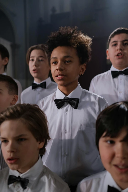 a group of children wearing white shirts and bow ties, an album cover, inspired by Alton Tobey, antipodeans, still from movie, mixed race, from netflix's arcane, looking to his left
