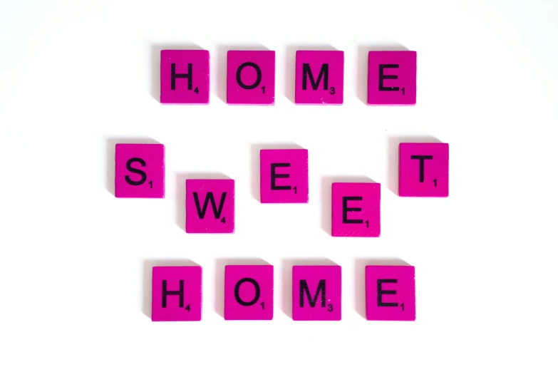 pink scrabbles spelling home sweet home, by Juliette Wytsman, flickr, home photography portrait, with a white background, 28mm, photography of kurzgesagt
