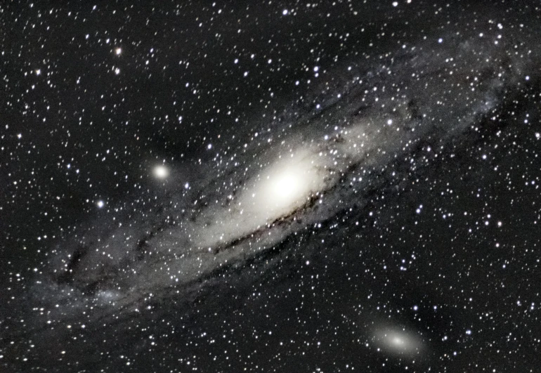 a close up of a galaxy with stars in the background, by Jim Nelson, andromeda galaxy, very sharp and detailed image, deep space background, on a gray background