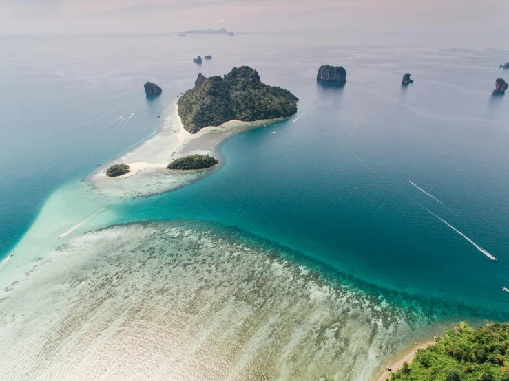 an aerial view of an island in the middle of the ocean, by Adam Dario Keel, pexels contest winner, sumatraism, skull island, thumbnail, thai, hd footage