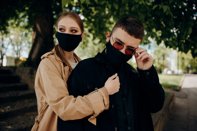 a man and a woman wearing face masks, by Emma Andijewska, trending on pexels, black oversized clothes, russian girlfriend, with sunglasses, ready - made