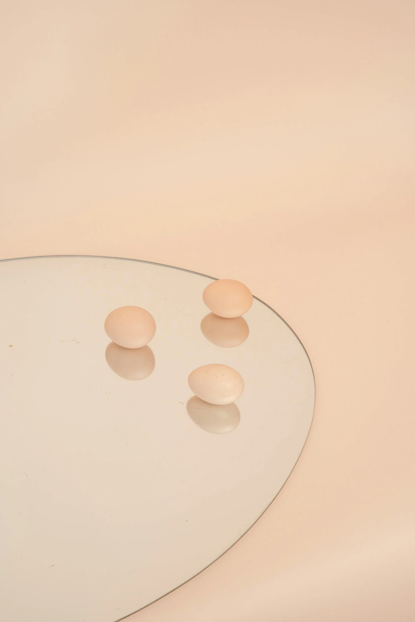 a white sink sitting under a mirror next to a faucet, an album cover, inspired by Raoul De Keyser, trending on unsplash, translucent eggs, pastel pink skin tone, ignant, jewelry pearls