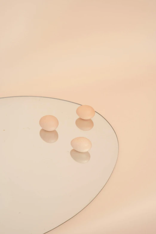 a white sink sitting under a mirror next to a faucet, an album cover, inspired by Raoul De Keyser, trending on unsplash, translucent eggs, pastel pink skin tone, ignant, jewelry pearls