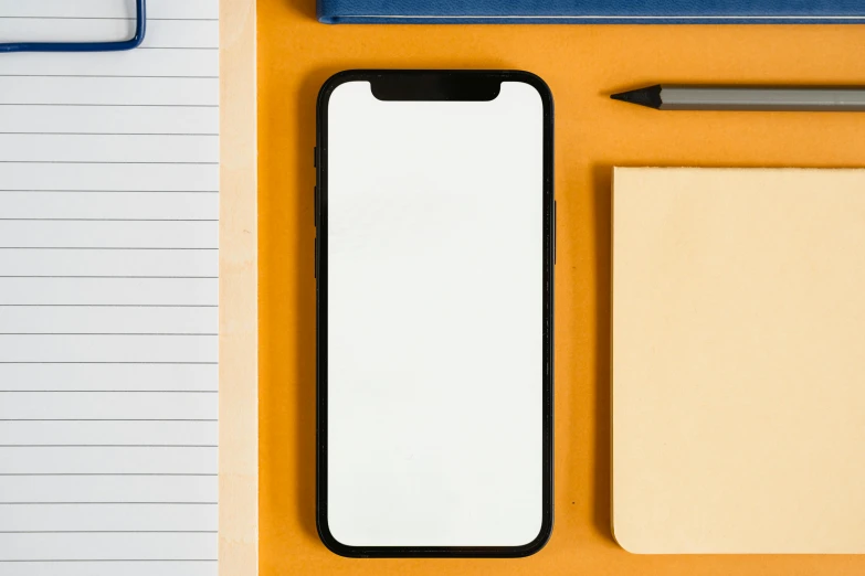 a cell phone sitting on top of a desk next to a notebook, rounded shapes, on a yellow canva, iphone wallpaper, square lines