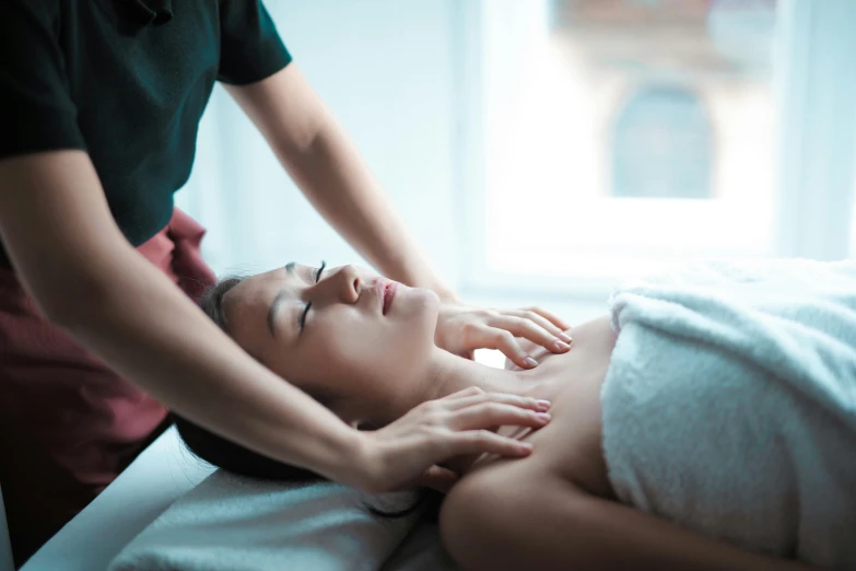 a woman getting a massage at a spa, unsplash, massurrealism, fan favorite, manuka, coerent face and body, vivid colour