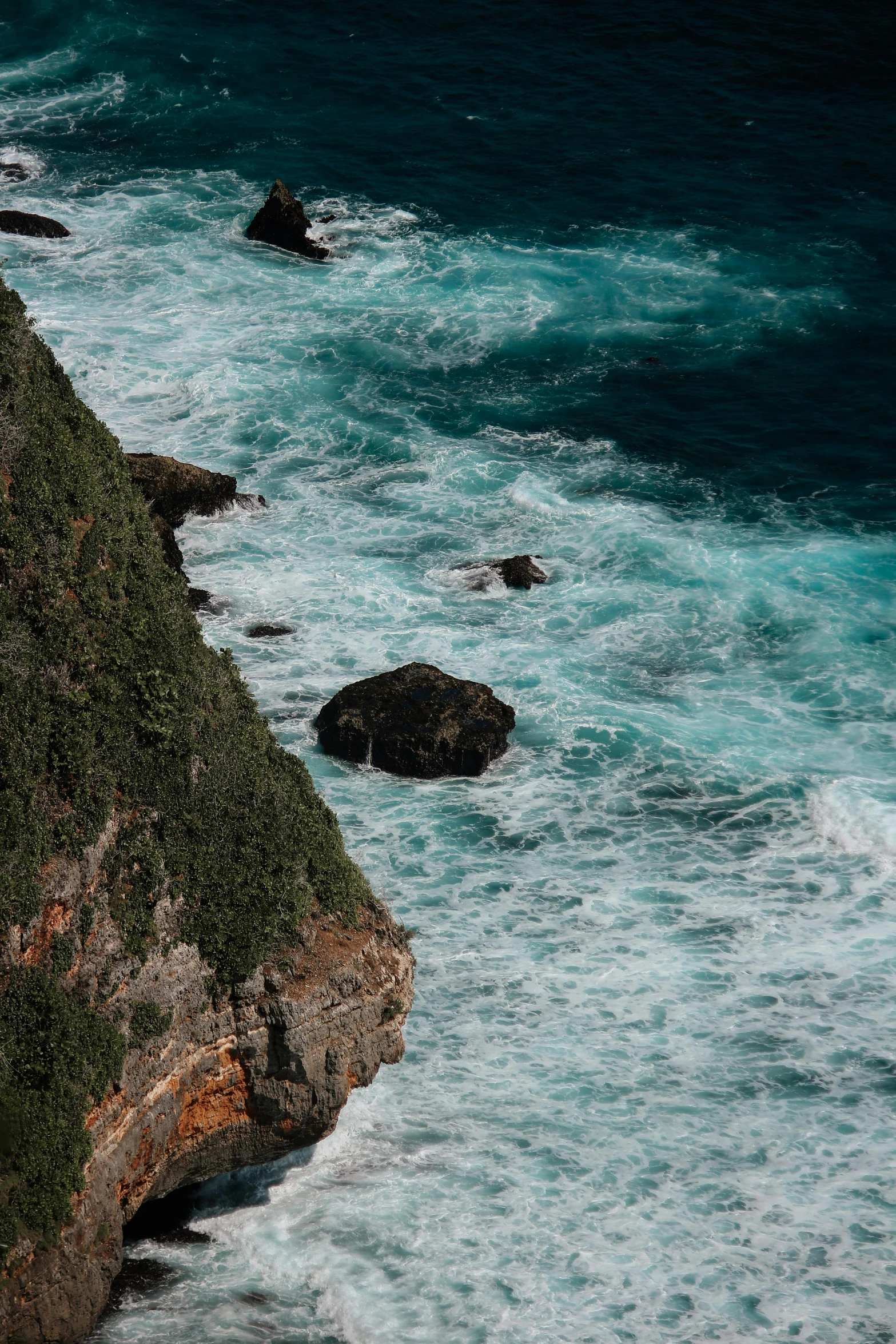 a group of people standing on top of a cliff next to the ocean, azure waves of water, zoomed in, slide show, teal aesthetic