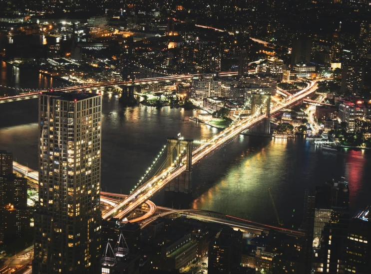 an aerial view of a city at night, pexels contest winner, brooklyn background, bridges, night time footage, 2000s photo