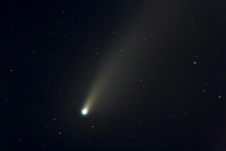 a comet shines brightly in the night sky, by Jason Felix, pexels, hubble, a handsome, getty images, thallasophobia