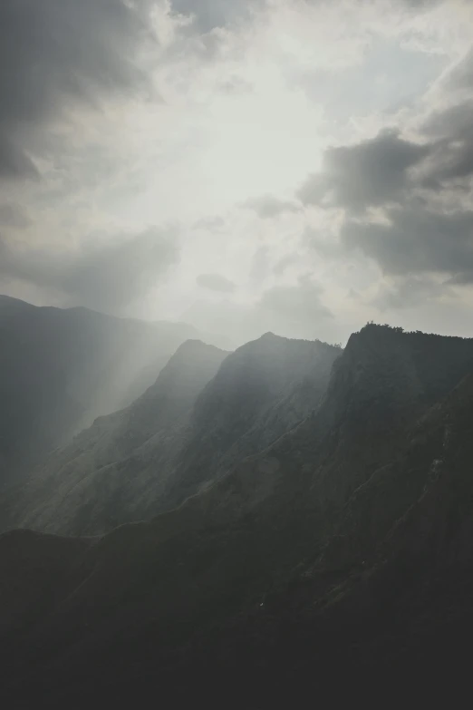 the sun shines through the clouds over the mountains, a picture, by Tobias Stimmer, romanticism, alessio albi, dramatic lighting - n 9, grey, high quality image