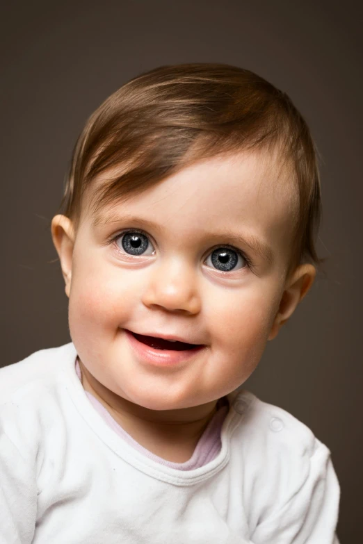 a close up of a baby smiling at the camera, by David Simpson, studio photographic portrait, color photograph portrait 4k, short brown hair and large eyes, high - resolution photograph