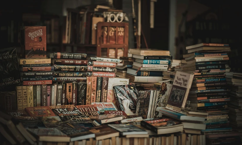 a pile of books sitting on top of a table, pexels contest winner, maximalism, brown, market, instagram post, historical image