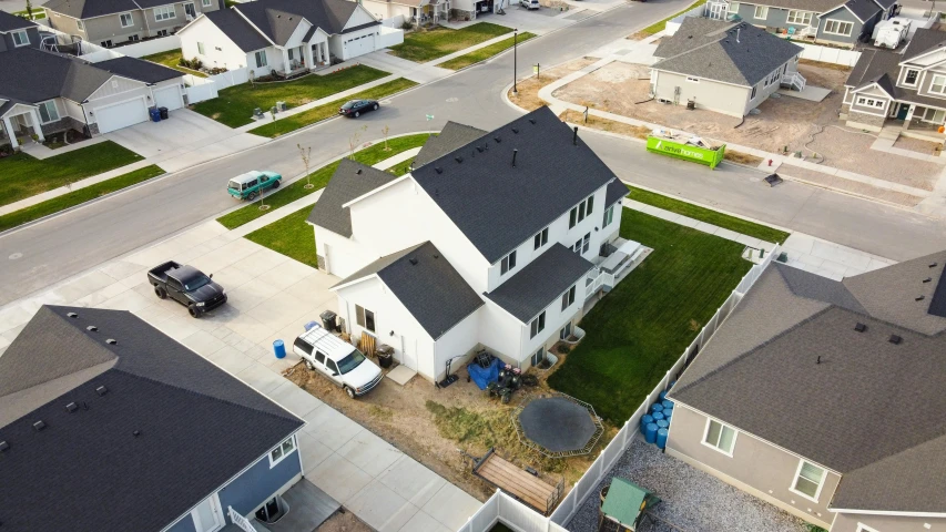 a view of a neighborhood from a bird's eye view, reddit, photorealism, white plank siding, aerial footage, 2 0 2 2 photo