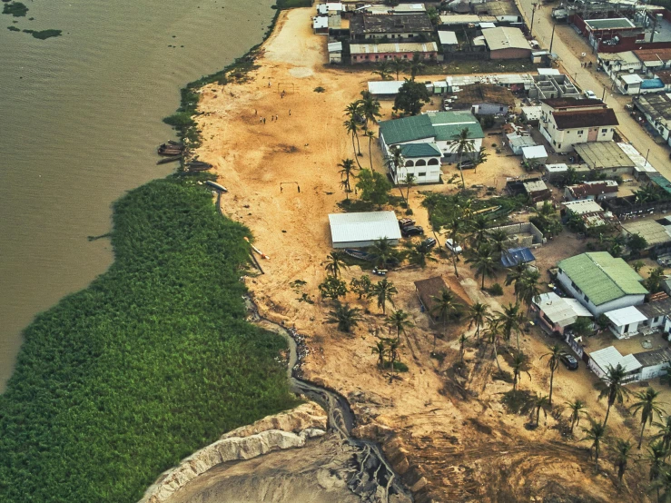 an aerial view of a city next to a body of water, by Daniel Lieske, dakar, erosion, instagram picture, slide show