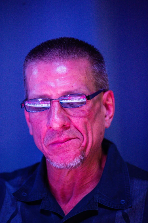 a close up of a person wearing glasses, by Arnie Swekel, blue rim lighting, leonard nimoy, portait image