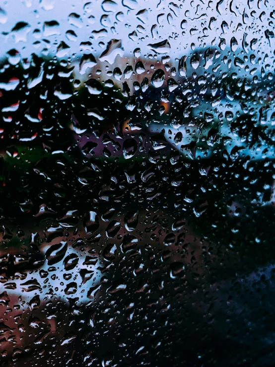 a close up of a window with raindrops on it, a picture, inspired by Elsa Bleda, pexels contest winner, outside in parking lot, hyperdetailed, promo image, vibrant dark mood