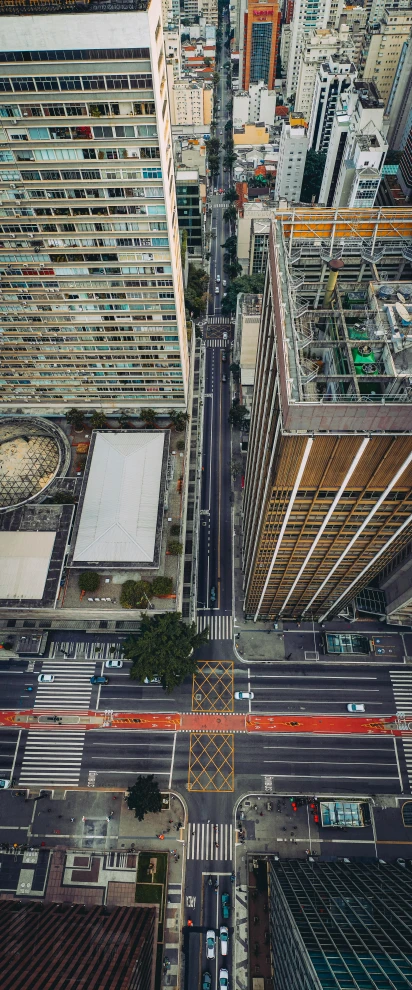 a city filled with lots of tall buildings, by Dan Scott, pexels contest winner, photorealism, intersection, concrete building, 15081959 21121991 01012000 4k, high angle uhd 8 k