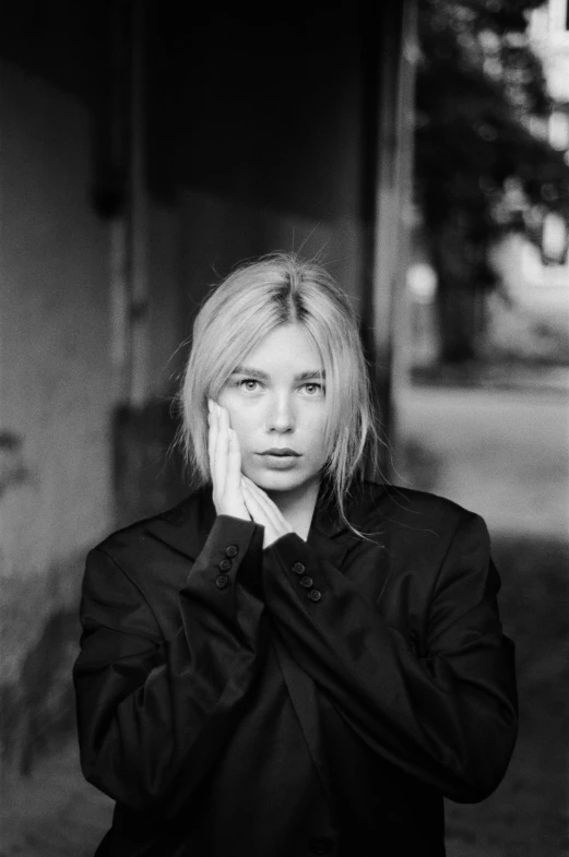 a black and white photo of a woman talking on a cell phone, by Anna Boch, portrait of scarlett johansson, medium format, blonde crea, portait image