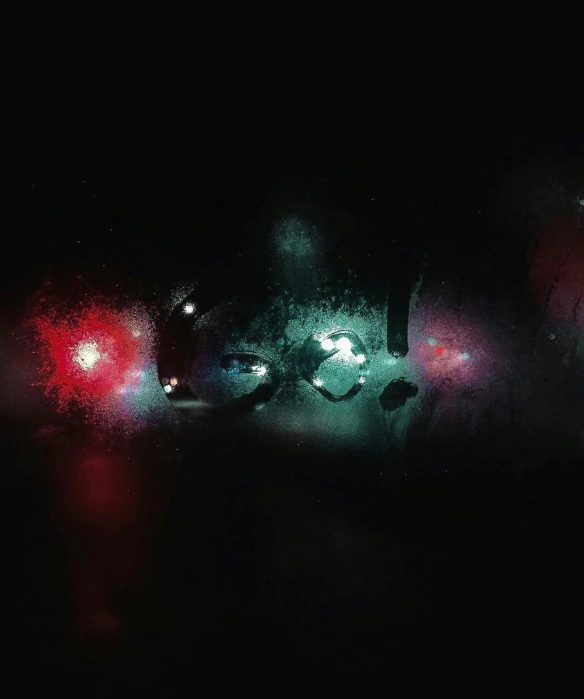 a couple of cars driving down a street at night, an album cover, by Thomas Bock, realism, red green black teal, particles disintegration, threyda, highly [ detailed ]