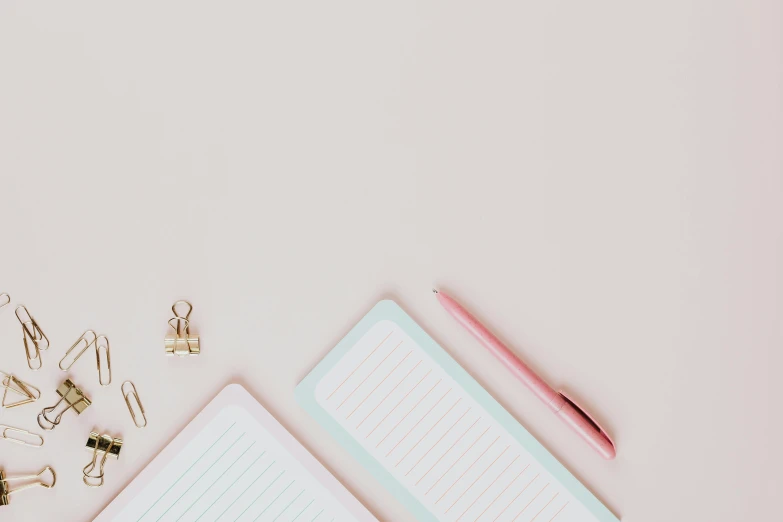 a cup of coffee and a notebook on a table, by Emma Andijewska, trending on pexels, minimalism, pink pastel, background image, gold accessories, thumbnail