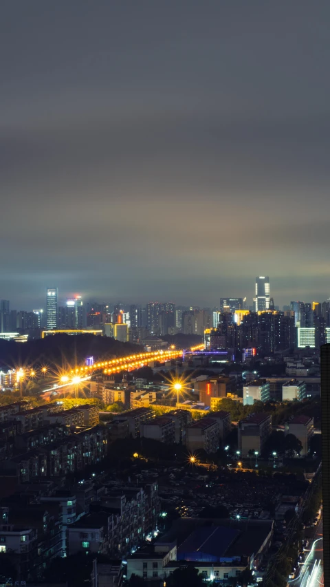 an aerial view of a city at night, a matte painting, inspired by Cheng Jiasui, pexels contest winner, square, shenzhen, dramatic lighting - n 9, high quality photo