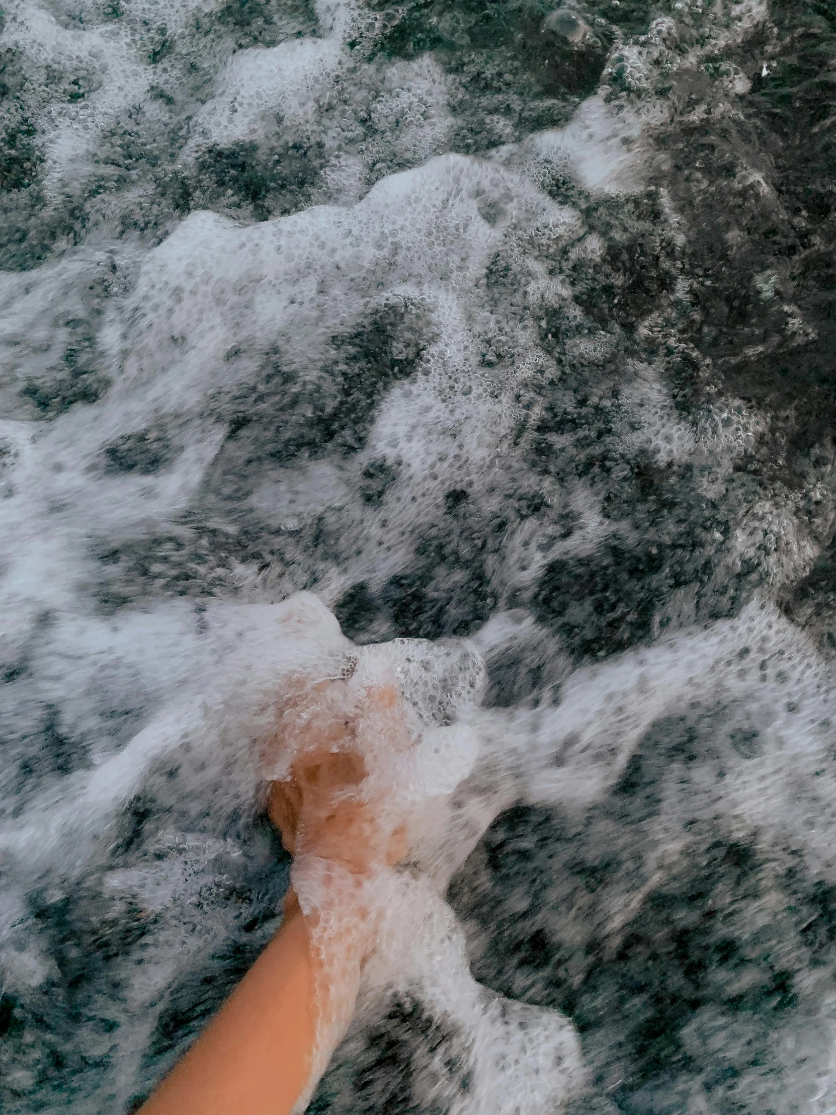 a person riding a wave on top of a surfboard, puddles of water, trending on vsco, marbled veins, bubbly