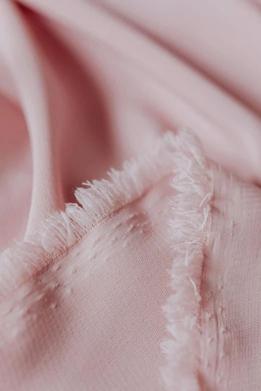 a close up of a pink shirt with fray edges, beautiful flowing fabric, detailed product shot, ((pink)), made of fabric