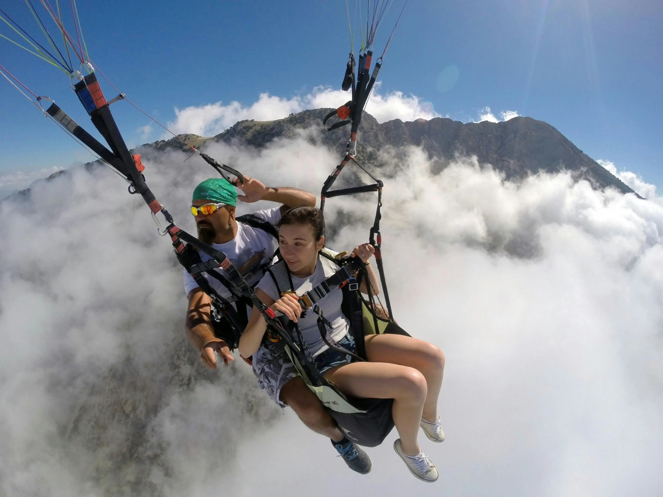 a couple of people riding on top of a parachute, a picture, by Niko Henrichon, hurufiyya, flying above the clouds, avatar image