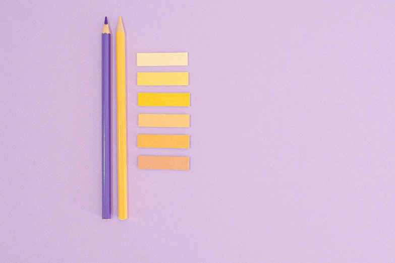 a pencil and some colored pencils on a purple surface, by Nicolette Macnamara, color field, yellow color scheme, light orange values, candy pastel, pantone color