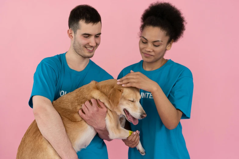 a couple of people that are holding a dog, by Olivia Peguero, cavities, wearing a t-shirt, pink and teal, acupuncture treatment