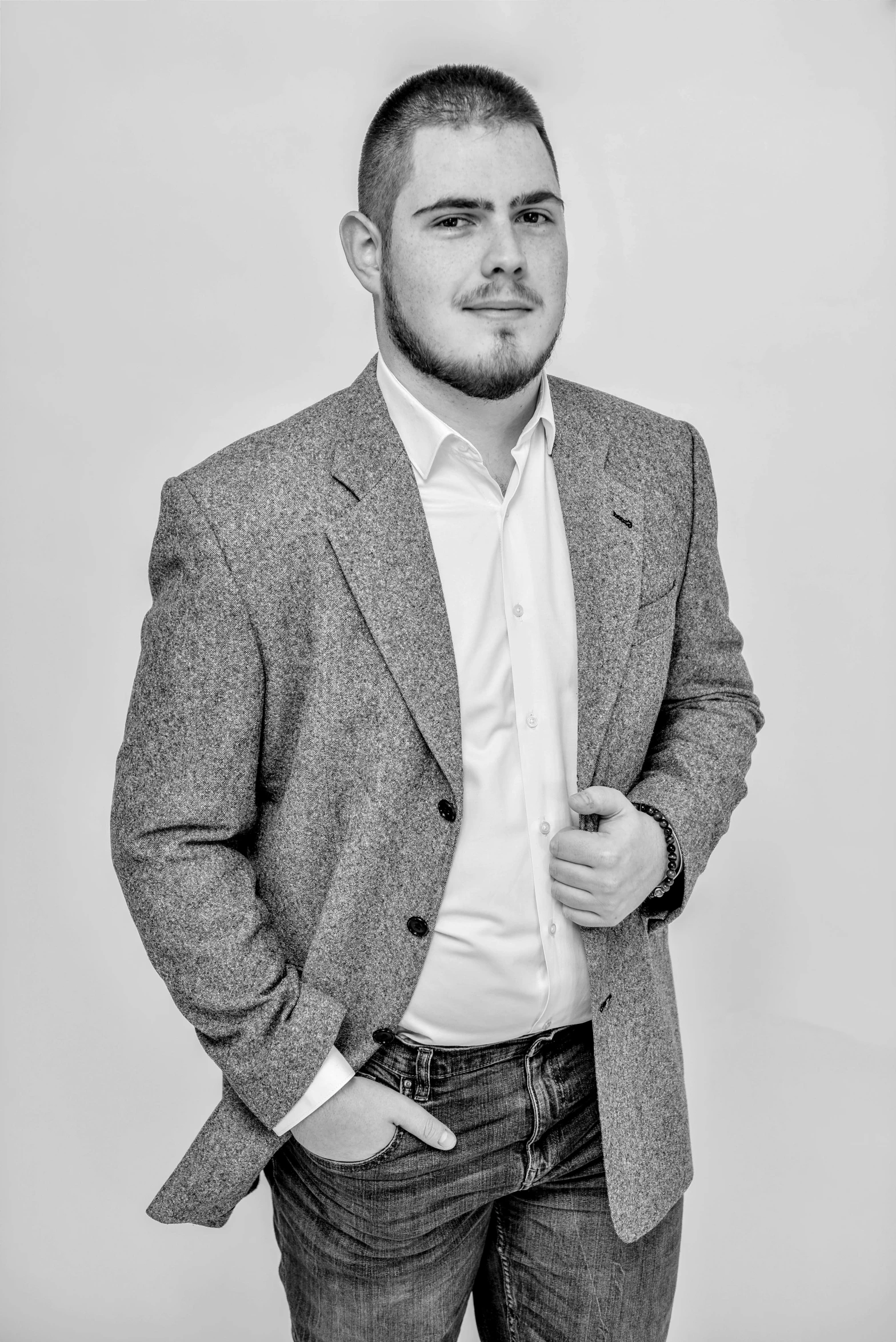 a black and white photo of a man in a suit, a black and white photo, by Alexander Fedosav, twitch streamer / gamer ludwig, professional detailed photo, dressed casually, professional product photo