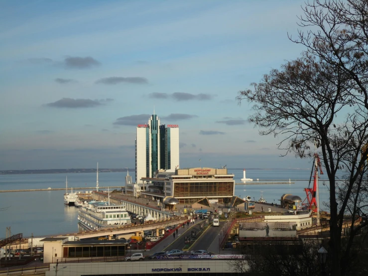 a large body of water next to a city, by Sven Erixson, pexels contest winner, art nouveau, tallinn, soviet brutalism, terminal, three views