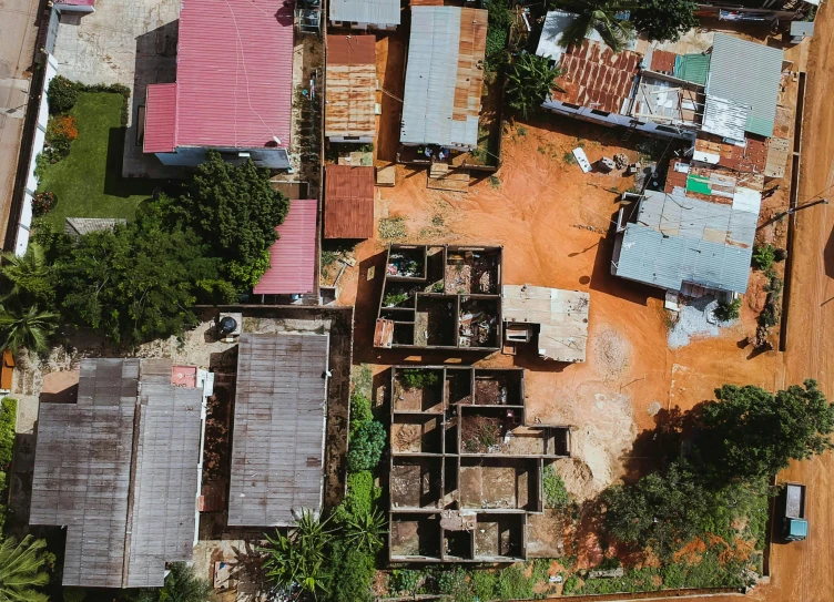 a bird's eye view of a small town, pexels contest winner, conceptual art, metal rust and plaster materials, jamaica, mud and brick houses, high res 8k