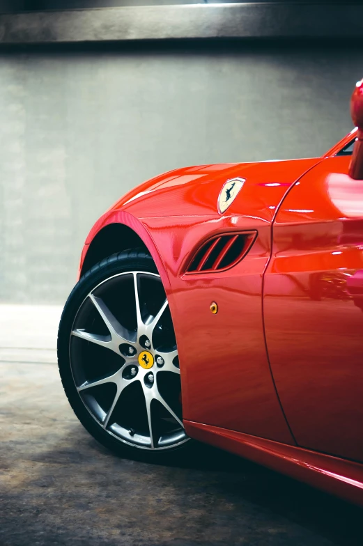 a red sports car parked in a parking garage, pexels contest winner, photorealism, detailed veins, ferrari, detail shots, aftermarket parts